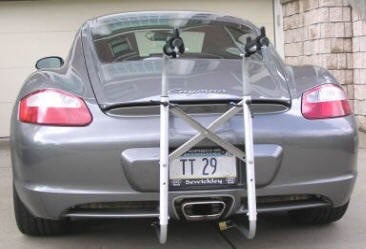 Bicycle Racks, eBike Racks for Porsche Cayman 987. 
3 minute on/off. Stores inTrunk. No cut, drill or removals to install under car parts. Inconspicuous